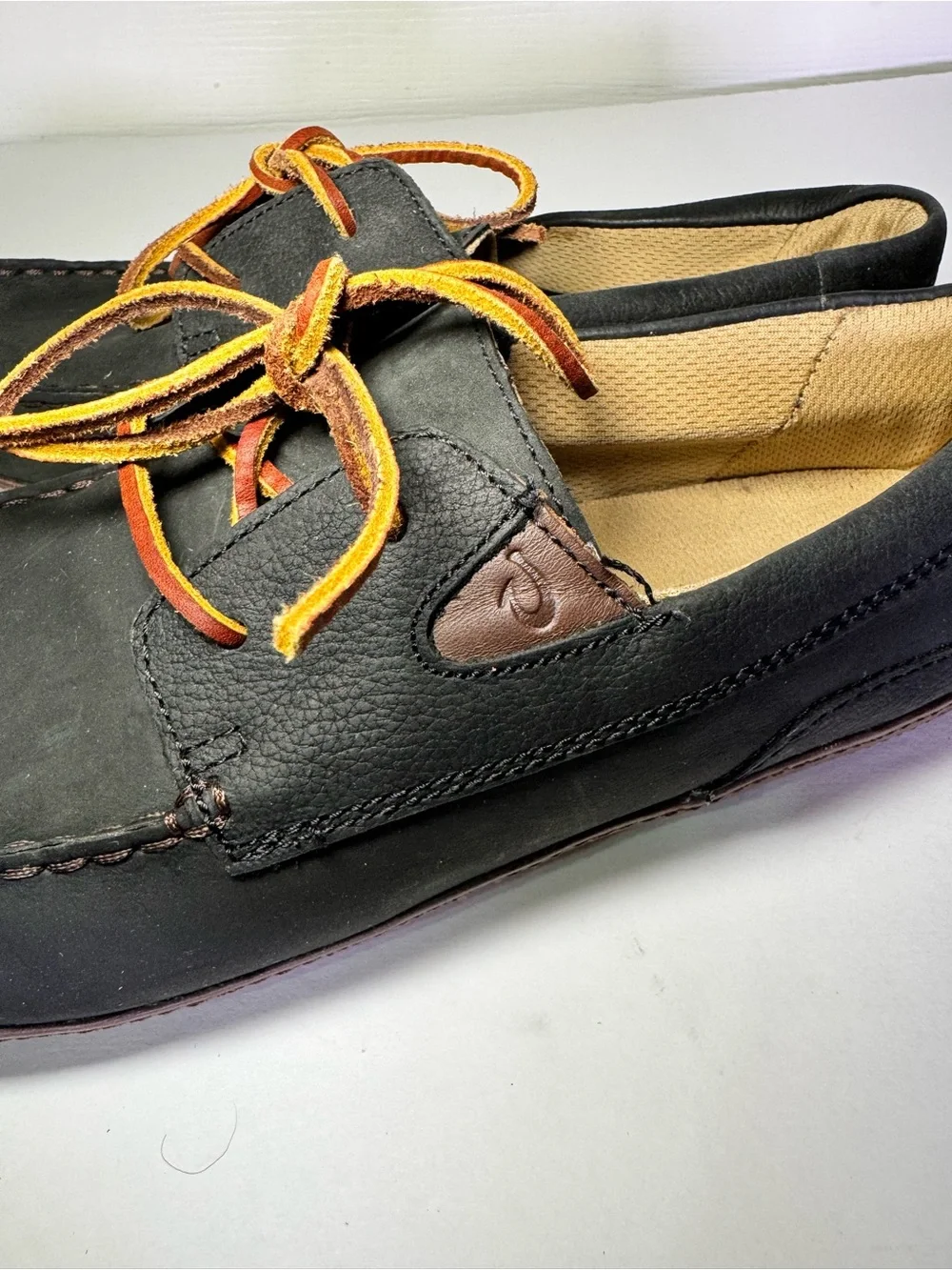 OluKai Black and Brown Leather Boat Moccasins with Tan Laces